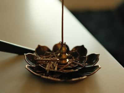 Incense smoke in a quiet room prepared for meditation.